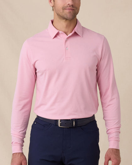Model wearing the Cambridge Long Sleeve Polo in Punch Pink, front view