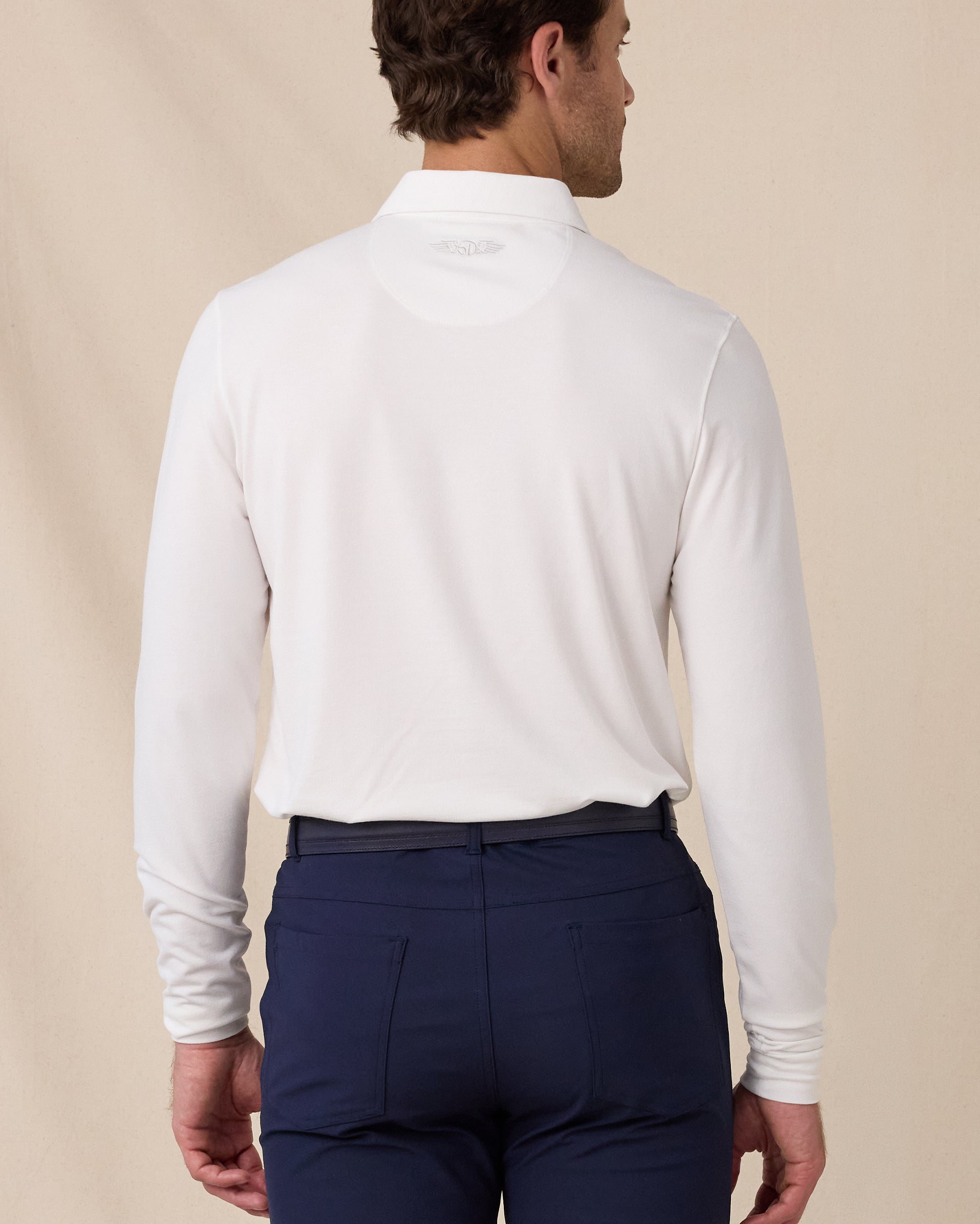 Back view of the Cambridge Long Sleeve Polo in White showcasing the clean silhouette