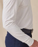 Close-up of the Cambridge Long Sleeve Polo in White highlighting the oxford pique knit texture and relaxed long-sleeve fit