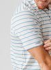 Men's Zuma Stripe Polo with White Base and Delphinium Blue & Soft Yellow Multi-Stripe Detailing, detailed close up sleeve view on model