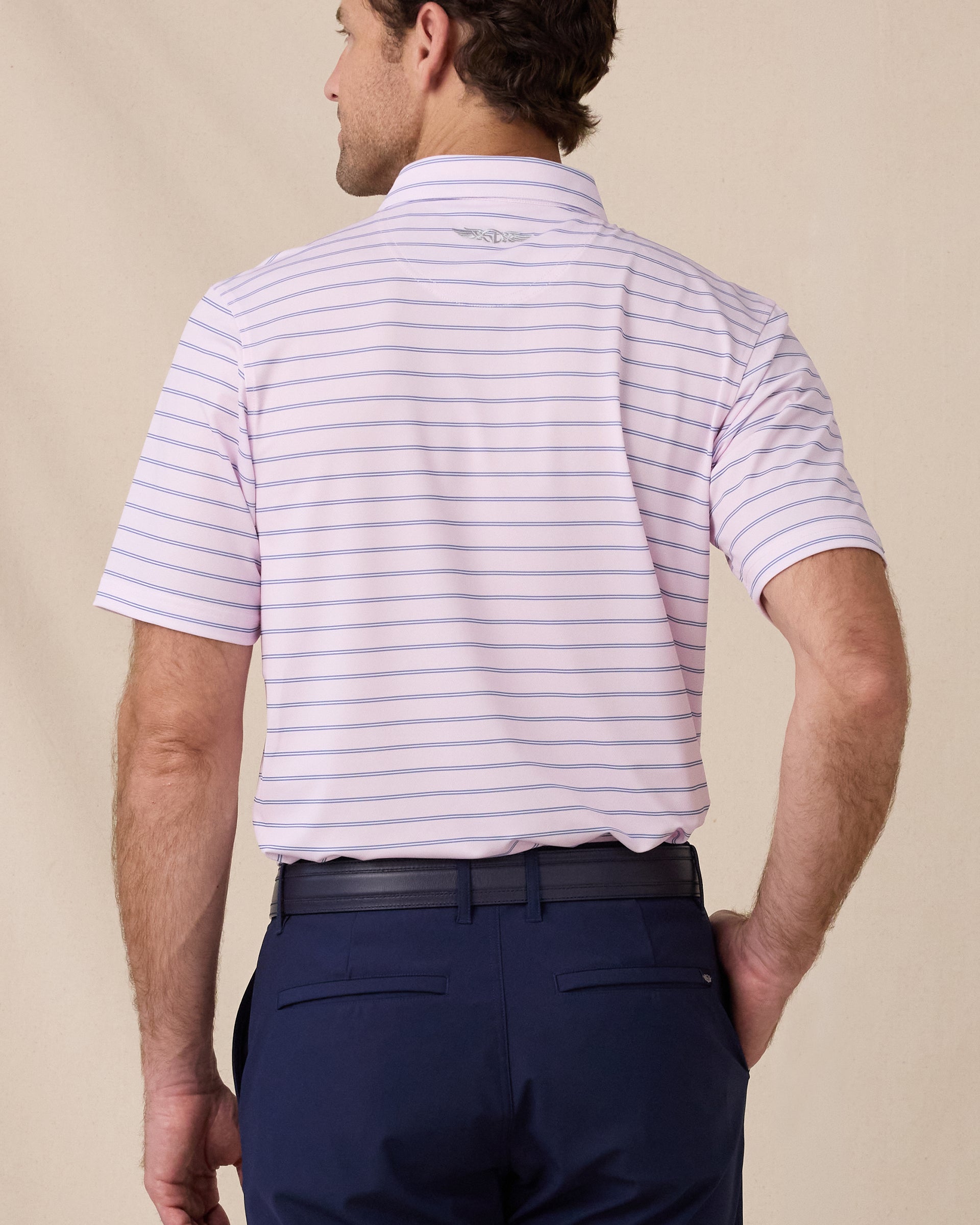 Back view of the Quintero Stripe Polo in Lilac featuring an allover stripe pattern and embroidered Straight Down logo below the collar
