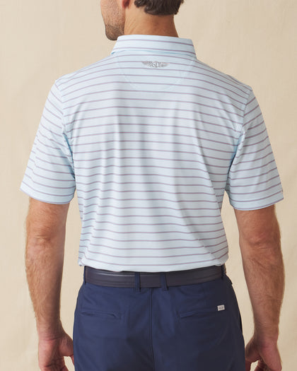 Men's Quintero Stripe Polo in Sea Spray, back model view featuring a light blue short sleeve polo with horizontal pink and steel blue pencil stripes with the Straight Down logo at the back collar