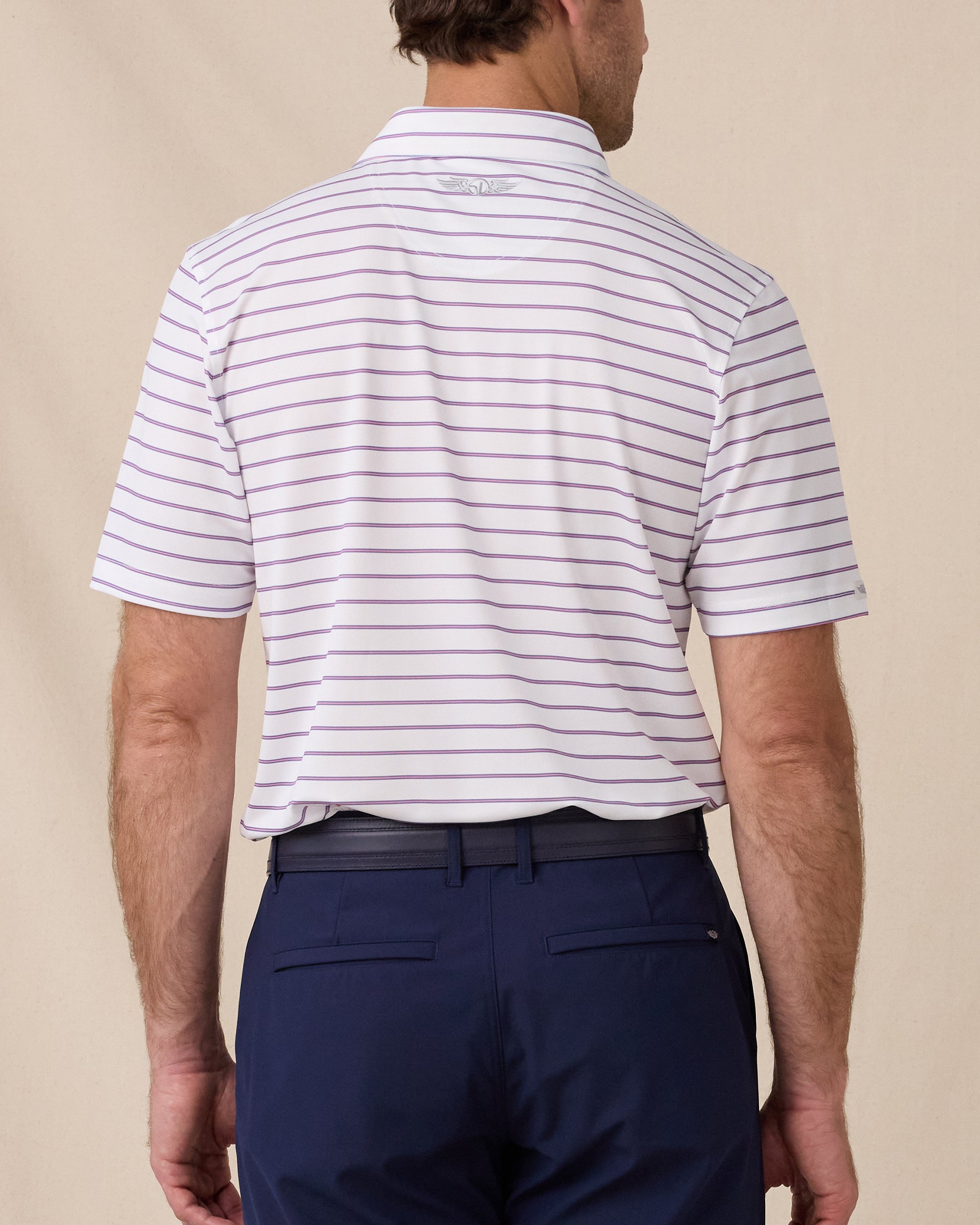 Back view of the Quintero Stripe Polo in Tidal featuring an allover blue and pink stripe pattern and embroidered Straight Down logo below the collar