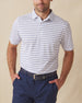 Men's Quintero Stripe Polo in Violet, front model view featuring a white short sleeve polo with horizontal blue and navy pencil stripes paired with navy pants and a navy belt