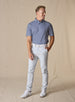 Del Mar Stripe Polo in New Indigo, full-body model styled with light pants