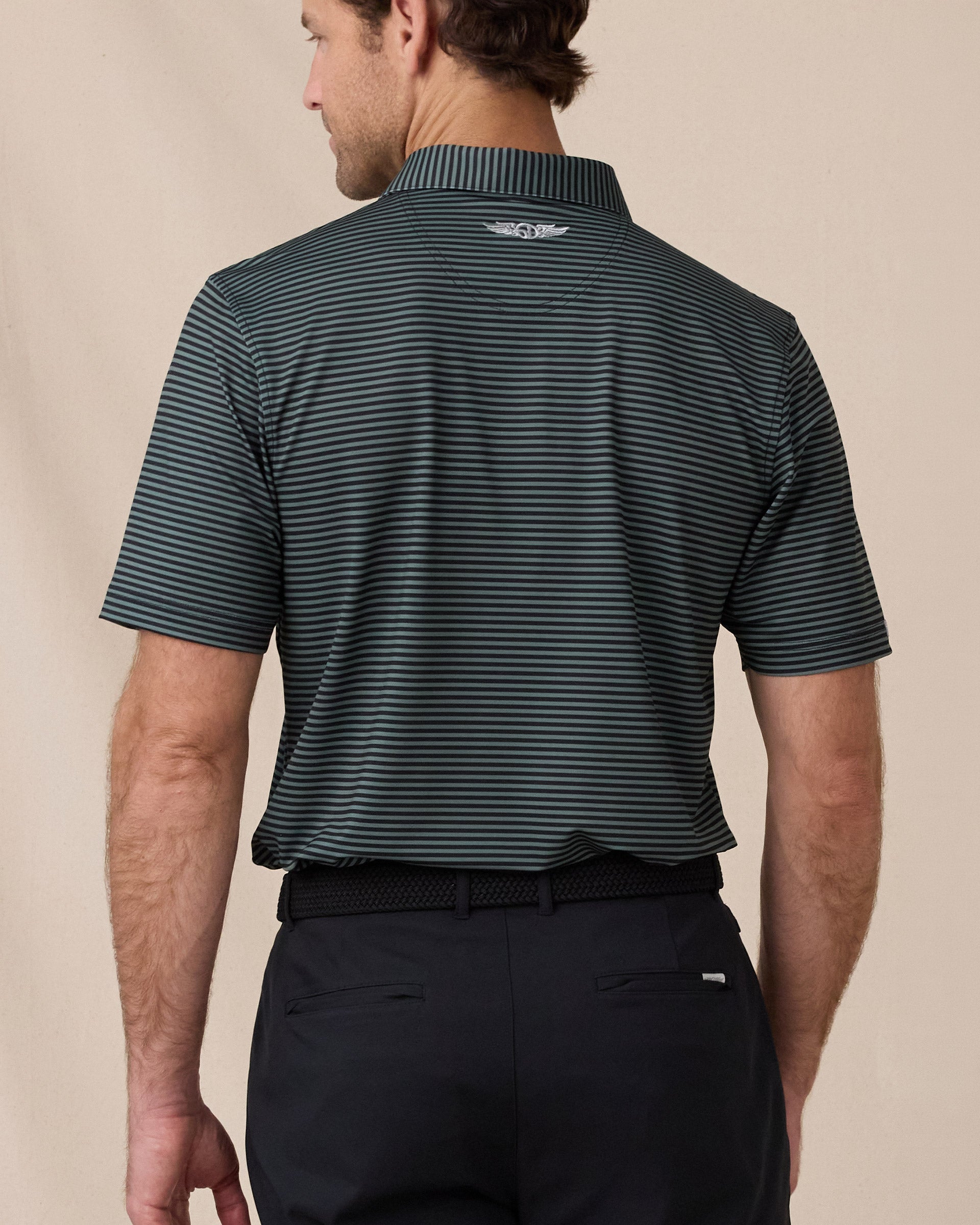 Del Mar Stripe Polo in Dark Forest Green, back lifestyle view on model