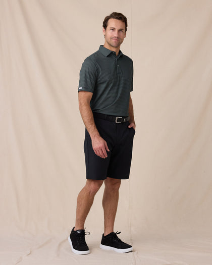 Del Mar Stripe Polo in Dark Forest Green, full-body lifestyle view on model styled with black shorts