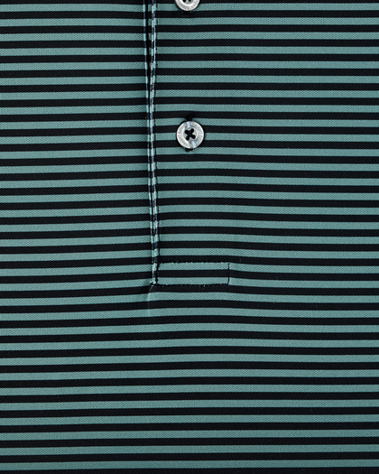 Close-up of dark green and black striped performance golf polo with button placket