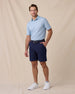 Del Mar Stripe Polo in Mint Tea, full-body lifestyle view on model styled with navy shorts