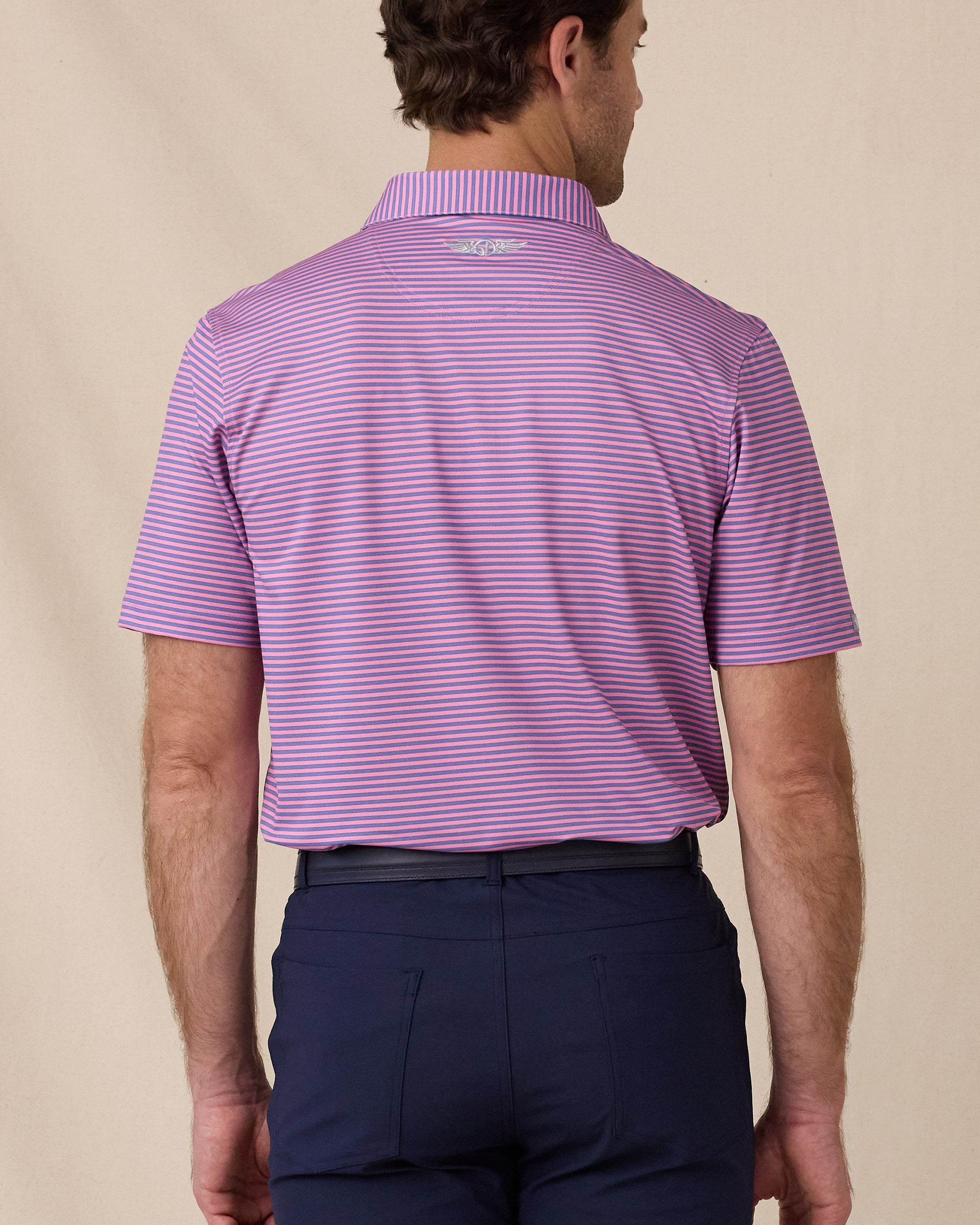 Del Mar Stripe Polo in Punch Pink, back lifestyle view on model