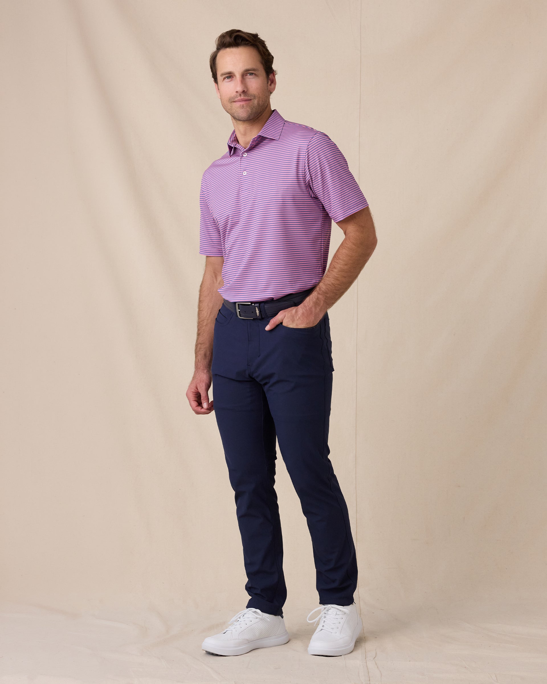 Del Mar Stripe Polo in Punch Pink, full-body lifestyle view on model styled with navy pants