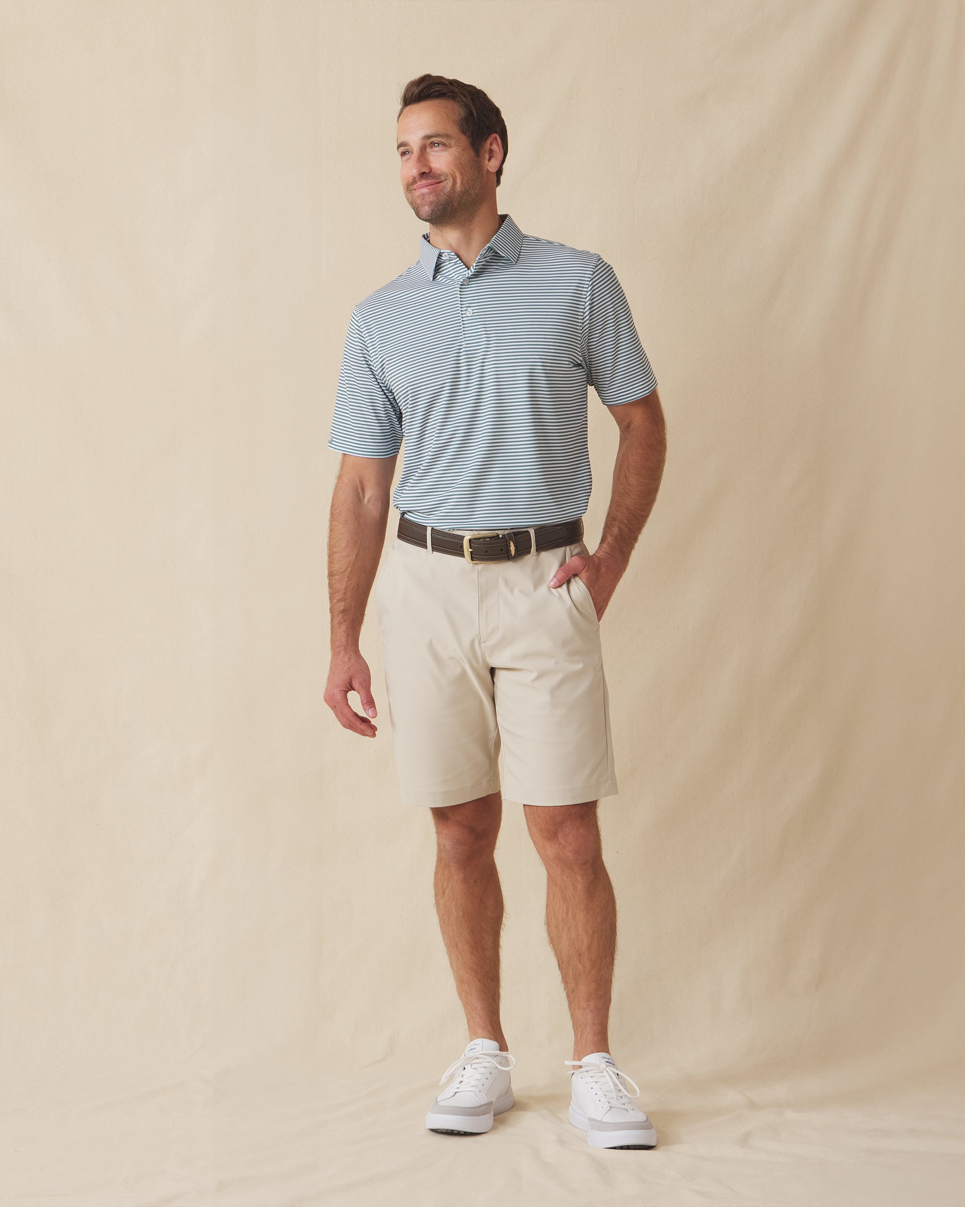 Del Mar Stripe Polo in Sage Green, full-body lifestyle view on model styled with light shorts