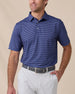 Men’s striped tidal blue polo with short sleeves and button placket, paired with silver shorts