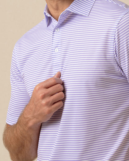 Close-up of men’s striped violet polo collar and button placket with clean, minimal design