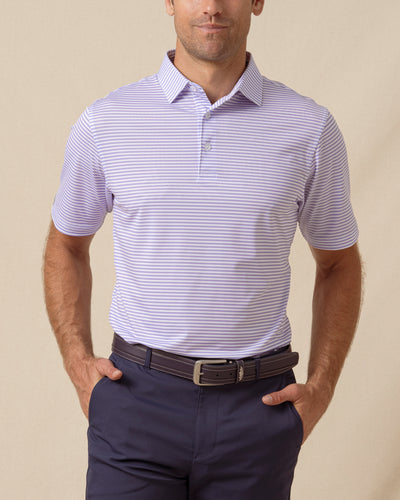 Men’s striped violet polo with short sleeves and button placket, paired with navy shorts