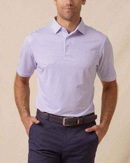 Men’s striped violet polo with short sleeves and button placket, paired with navy shorts
