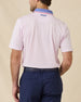 Back view of the Chorro Polo in Lilac featuring a clean solid design and embroidered Straight Down logo below the collar