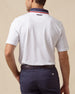 Chorro Polo in White with New Indigo collar and red trim, back model view