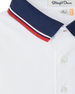 Chorro Polo in White with New Indigo collar and red trim, fabric detail close-up view