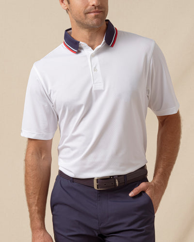 Chorro Polo in White with New Indigo collar and red trim, front model view