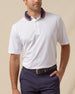 Chorro Polo in White with New Indigo collar and red trim, front model view