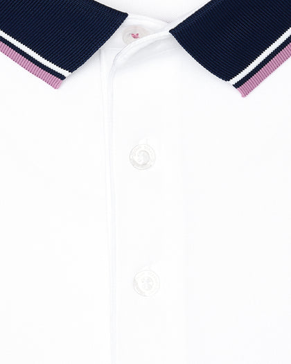 Men's Chorro Polo in Haze, close-up flat lay view featuring the contrast navy knit collar with white and pink stripe trim detail and button placket on a white short sleeve polo