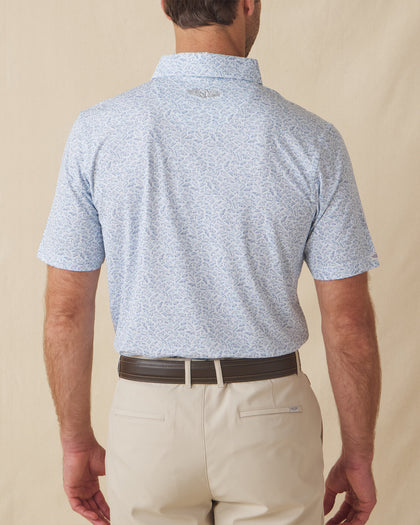 Men's American Muscle Polo in Moonlight, back view on model featuring a navy classic car sketch novelty print with Straight Down logo embroidered at the upper back, paired with khaki shorts