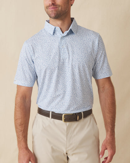 Men's American Muscle Polo in Moonlight, front view on model featuring a navy classic car sketch novelty print, paired with khaki shorts and a brown belt