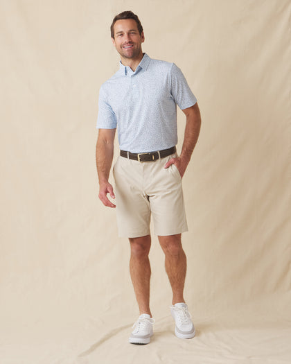 Men's American Muscle Polo in Moonlight, full-length front view on model featuring a navy classic car sketch novelty print, paired with khaki shorts and white shoes