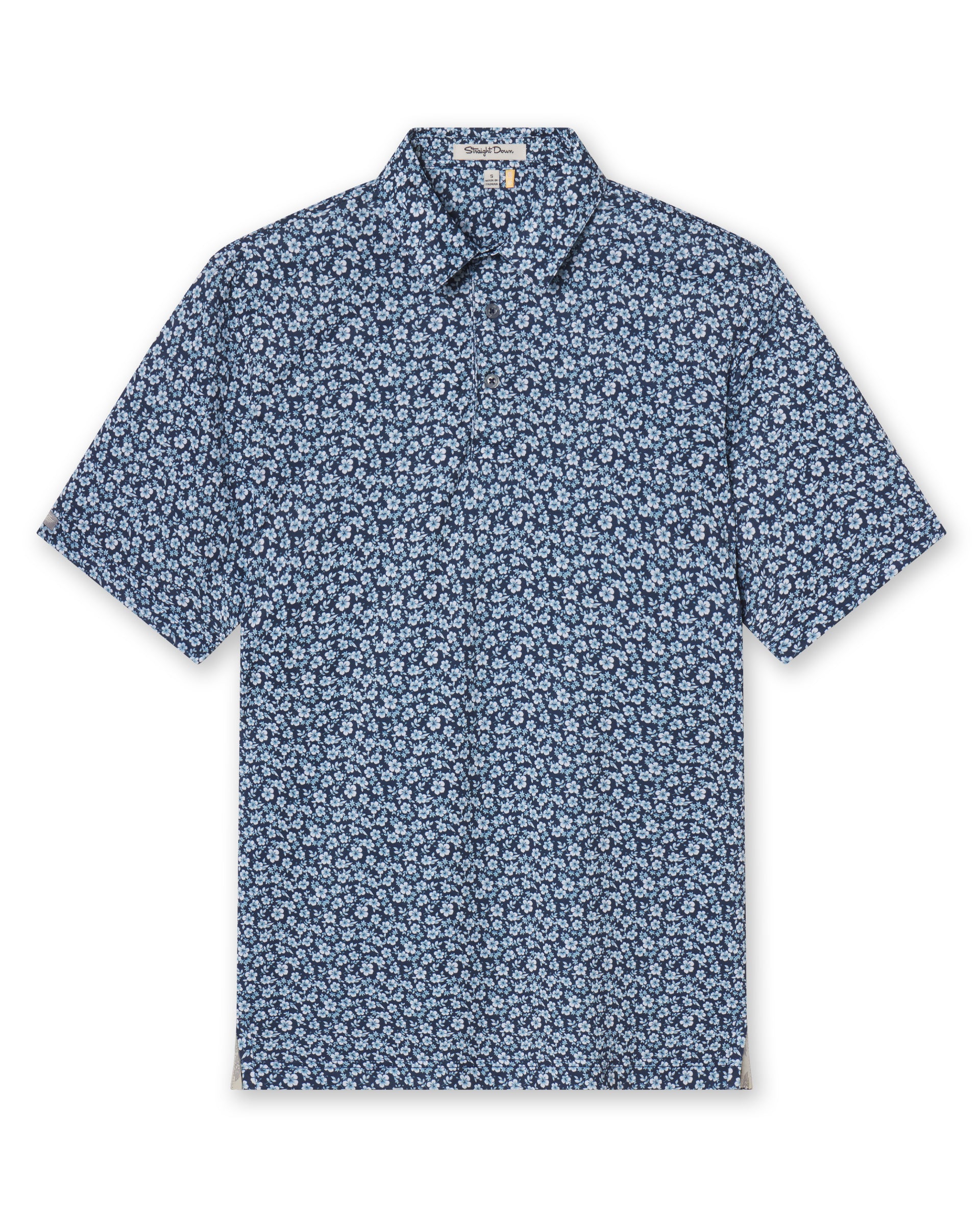 Men's Don Ho Polo in New Indigo, flat lay front view featuring a navy base with an all-over light blue floral print, with Straight Down logo patch visible on sleeve