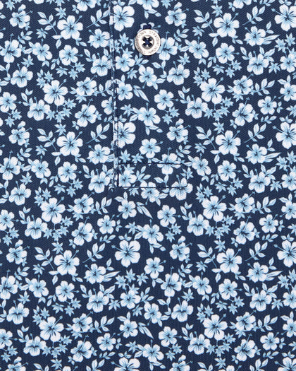Men's Don Ho Polo in New Indigo, close-up flat lay fabric detail view highlighting the all-over light blue floral print on a navy base