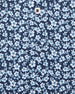 Men's Don Ho Polo in New Indigo, close-up flat lay fabric detail view highlighting the all-over light blue floral print on a navy base