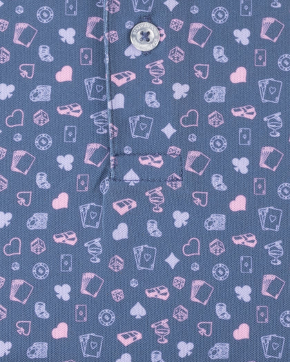 Men's Hold 'Em Polo in Moonlight, close-up fabric detail showing the allover casino print with playing cards, poker chips, dice