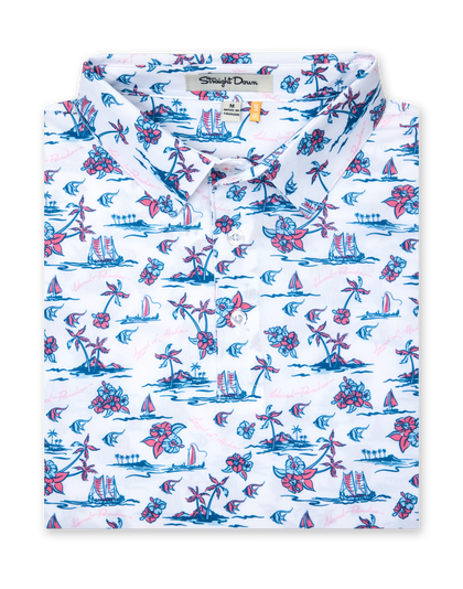 Men's Island Paradise Polo in Cool Blue, folded flat lay front view featuring an all-over tropical print with palm trees, hibiscus flowers, sailboats, and tropical fish and blue on a white body with a two-button placket and Straight Down label