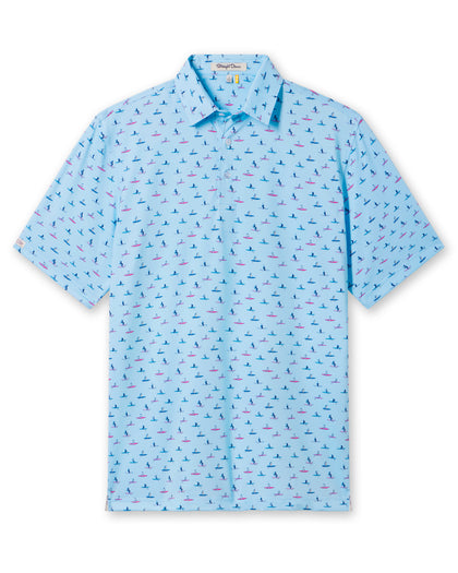 Men's Dog Paddle Polo in Cool Blue, flat lay front view featuring an all-over print of dogs paddle boarding on red and blue boards on a light blue body with a two-button placket and short sleeves