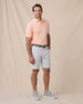 Peninsula Stripe Polo in Cantalope, full outfit model view styled with silver shorts
