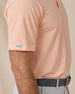 Men's Peninsula Stripe Polo in Cantalope, close-up sleeve view on model, fine horizontal stripe fabric and Straight Down woven label at the sleeve hem