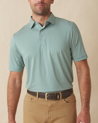Men's Peninsula Stripe Polo in Celery, front view on model featuring a green and white micro stripe pattern, paired with khaki pants and a leather belt