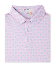 Wilshire Polo in Punch folded to showcase the subtle pink and blue geometric print