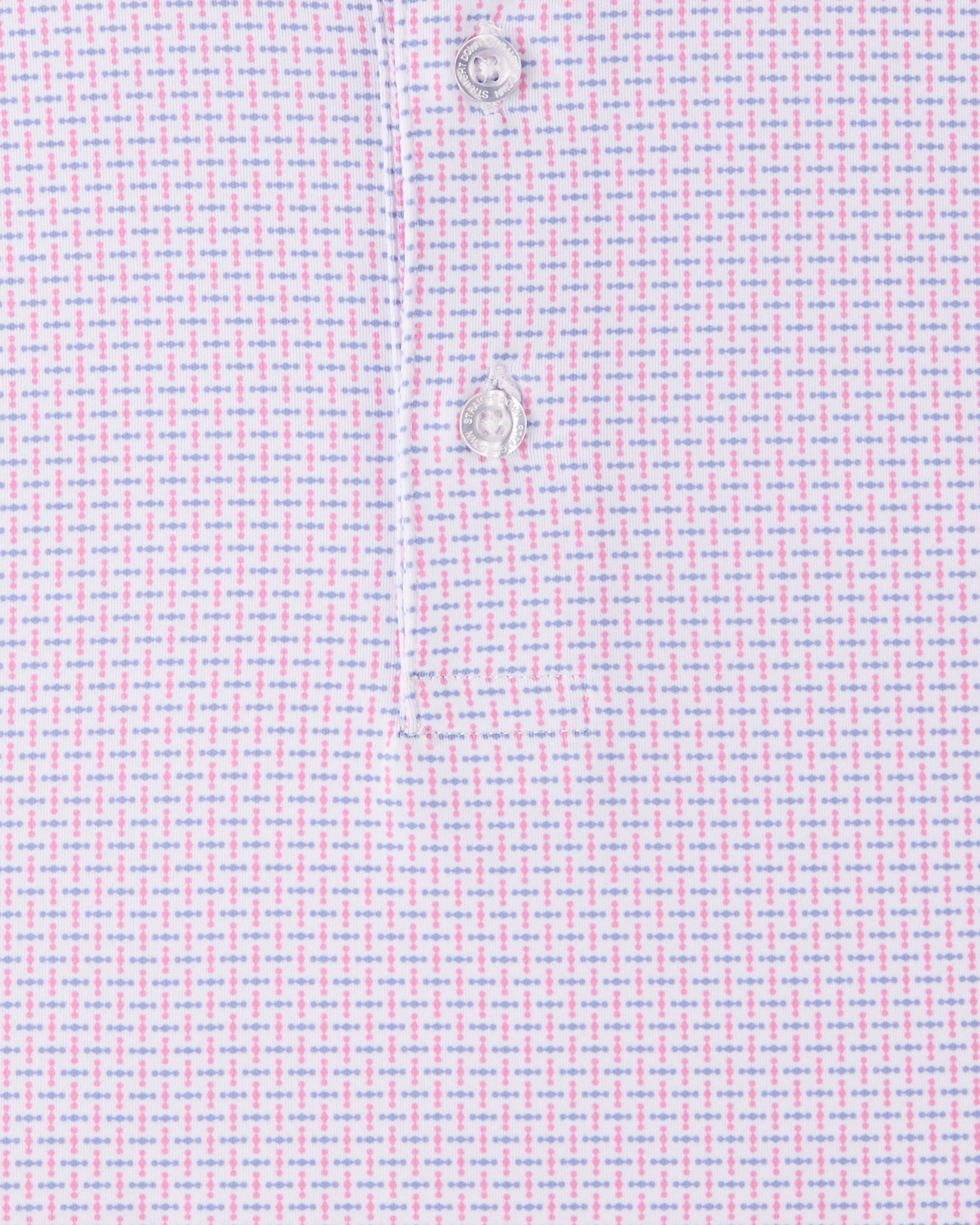 Close-up of the Wilshire Polo in Punch highlighting the pink and blue geometric pattern and performance jersey fabric