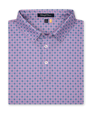 Men’s pink golf polo with blue geometric print, folded with button placket