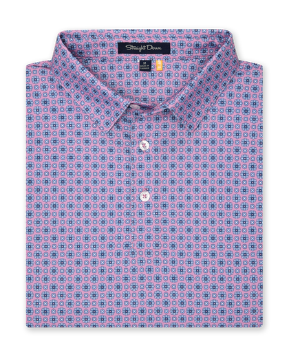 Men’s pink golf polo with blue geometric print, folded with button placket