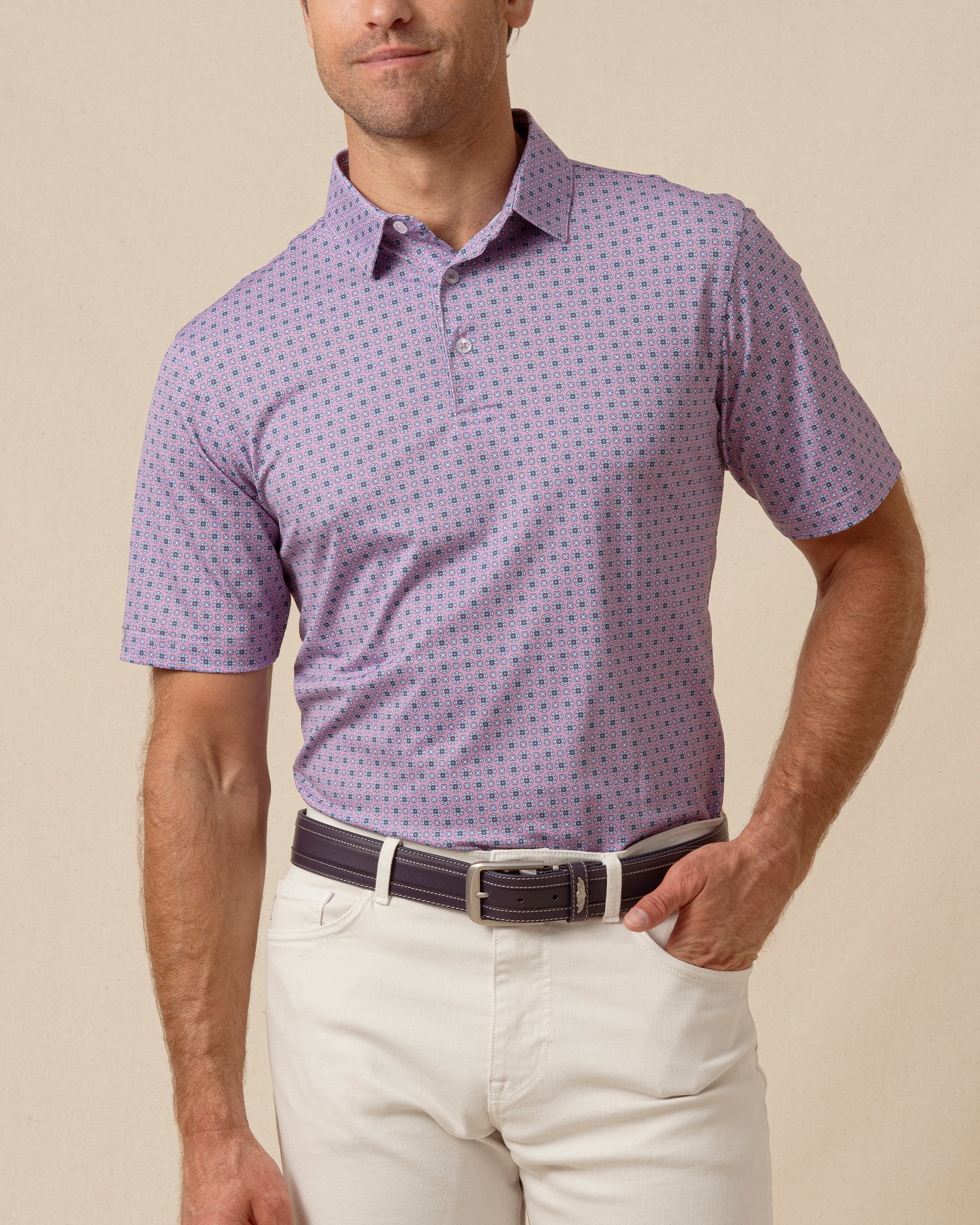 Men’s haze purple polo with allover geometric medallion print, worn with light khaki pants