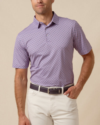 Men’s haze purple polo with allover geometric medallion print, worn with light khaki pants