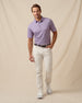 Men’s haze purple geometric print polo styled with light khaki pants, belt, and white sneakers