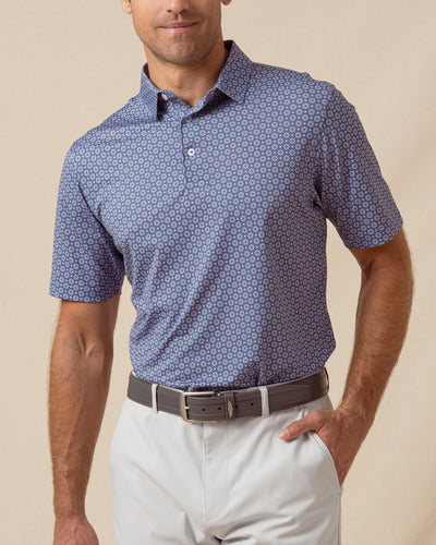 Men’s moonlight blue print polo shirt styled with light gray shorts and a leather belt