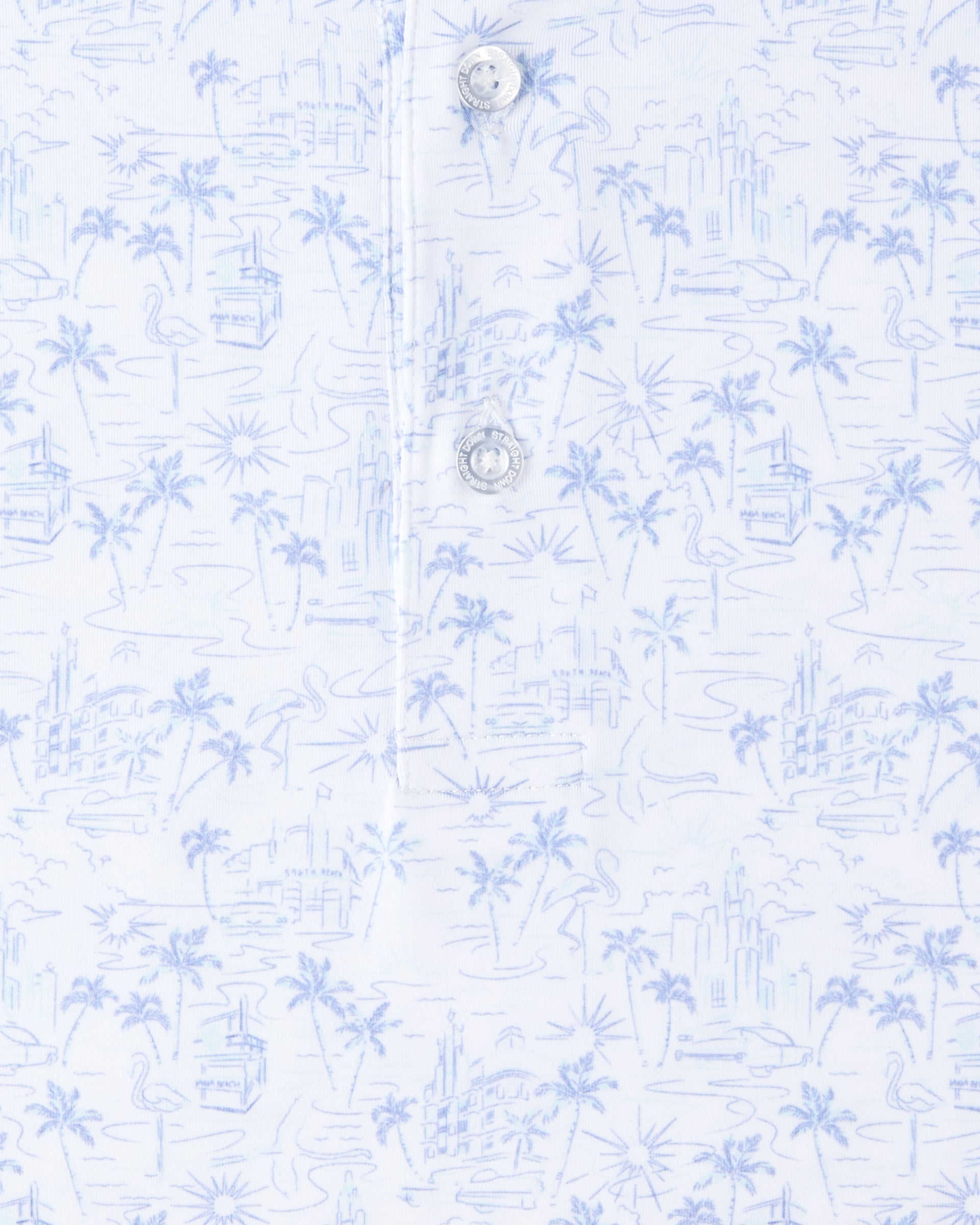 Close-up of the South Beach Polo in Blue Shade, highlighting the light blue illustrated print and branded buttons along the placket.
