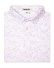 Men's South Beach Polo in Violet, folded flat lay front view featuring a white short sleeve polo with an all-over scenic print of palm trees, flamingos, and buildings in pink and lavender