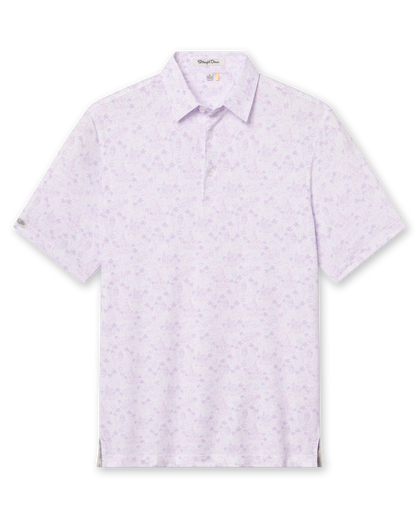 Men's South Beach Polo in Violet, flat lay front view featuring a white short sleeve polo with an all-over scenic print of palm trees, flamingos, and buildings in pink and lavender