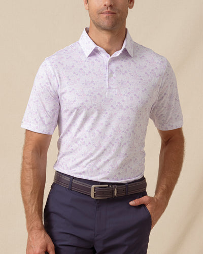 Men’s South Beach Polo in Violet with short sleeves and button placket, paired with navy shorts